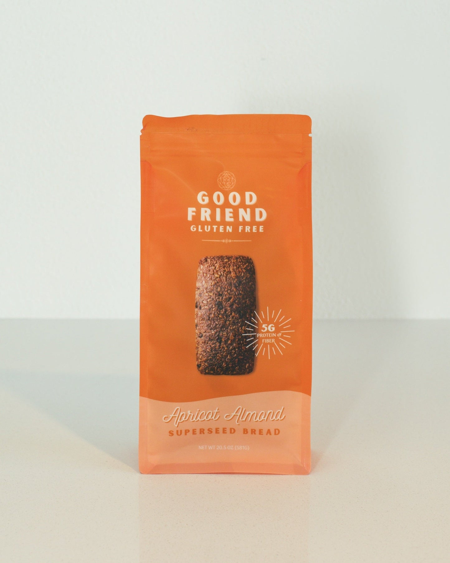 Orange package of Good Friend gluten-free bread on a white background